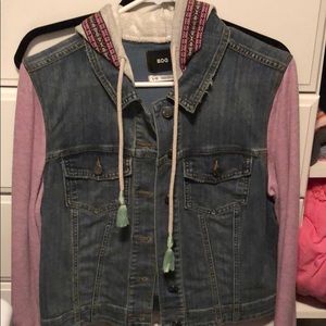 Large jean jacket with purple sleeves and hood